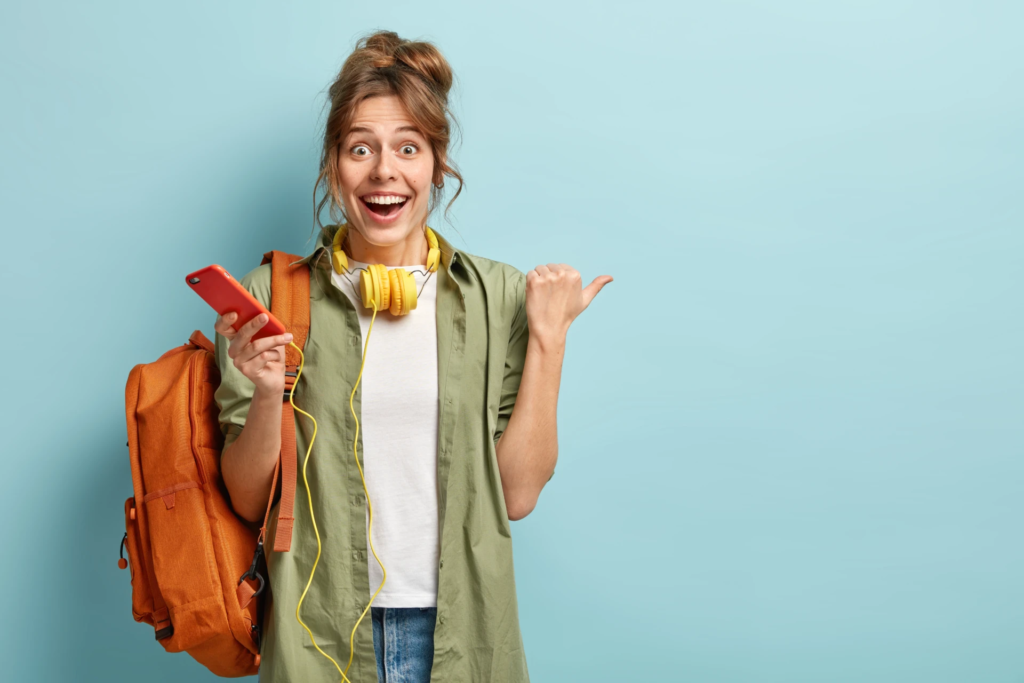 joyful-european-girl-checks-nootification-email-box-cellular